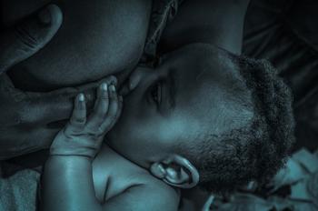 Image of woman breastfeeding a newborn baby